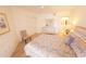 Cozy bedroom showcasing bright walls, a closet, a ceiling fan, and comfortable furnishings at 850 S Tamiami Trl # 704, Sarasota, FL 34236