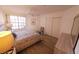 Bright bedroom with ceiling fan, closet and large window providing natural light at 850 S Tamiami Trl # 704, Sarasota, FL 34236