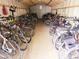 Interior bike storage room filled with a wide variety of bicycles, for community residents at 850 S Tamiami Trl # 704, Sarasota, FL 34236