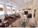 Large community clubhouse with multiple seating areas, a fireplace and a library at 850 S Tamiami Trl # 704, Sarasota, FL 34236