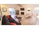 Relaxing living room featuring natural lighting, a fireplace, and modern decor at 850 S Tamiami Trl # 704, Sarasota, FL 34236