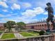 Elegant museum exterior with landscaped gardens and sculptures, cultural attraction at 850 S Tamiami Trl # 704, Sarasota, FL 34236