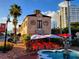 Charming restaurant with outdoor seating under red and white umbrellas, enhanced by blue fountain at 850 S Tamiami Trl # 704, Sarasota, FL 34236