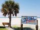 Scenic Siesta Beach view with a palm tree, sign, and white sands, the #1 beach in the USA at 850 S Tamiami Trl # 704, Sarasota, FL 34236
