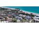 Gorgeous beachside home with lush landscaping, a pristine beach, and captivating ocean views at 8800 Midnight Pass Rd, Sarasota, FL 34242