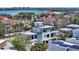 Modern home near the water and beaches, with a rooftop deck, and other new homes in the neighborhood at 8800 Midnight Pass Rd, Sarasota, FL 34242