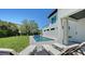 Relaxing backyard featuring a pool and lounge chairs at 8800 Midnight Pass Rd, Sarasota, FL 34242