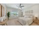 Comfortable bedroom with a bed, large window, and tasteful decor at 8800 Midnight Pass Rd, Sarasota, FL 34242