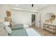 Cozy bedroom features twin beds, creating a comfortable and stylish space perfect for relaxation and restful nights at 8800 Midnight Pass Rd, Sarasota, FL 34242