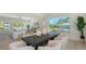 Bright dining area with large windows, modern decor, and a stylish dining table set at 8800 Midnight Pass Rd, Sarasota, FL 34242
