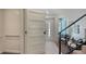Modern entryway with a stylish staircase and decorative accents, creating a welcoming atmosphere at 8800 Midnight Pass Rd, Sarasota, FL 34242