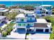 Stunning three-story home with a rooftop deck and modern architectural design, located near a beautiful beach at 8800 Midnight Pass Rd, Sarasota, FL 34242