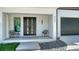 Inviting front entrance with modern double doors and stylish seating at 8800 Midnight Pass Rd, Sarasota, FL 34242