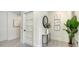 Hallway with artwork, modern table, and sleek interior design at 8800 Midnight Pass Rd, Sarasota, FL 34242