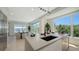 Modern kitchen featuring a large island with sink, stainless steel appliances, and an open-concept design at 8800 Midnight Pass Rd, Sarasota, FL 34242
