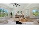 Bright and spacious living room with modern decor and large windows at 8800 Midnight Pass Rd, Sarasota, FL 34242