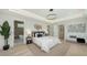 Tranquil main bedroom featuring elegant decor, a comfortable bed, and an ensuite bathroom at 8800 Midnight Pass Rd, Sarasota, FL 34242