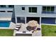 Inviting outdoor space with poolside seating, a built-in grill, and a charming patio area at 8800 Midnight Pass Rd, Sarasota, FL 34242