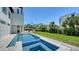Sparkling pool and spa with integrated stairs, next to lushly landscaped private backyard at 8800 Midnight Pass Rd, Sarasota, FL 34242