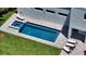 Backyard pool and spa featuring a modern design with a gray brick paver patio and lounge chairs at 8800 Midnight Pass Rd, Sarasota, FL 34242