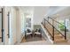 Inviting entry with a staircase, and stylish seating for guests at 8800 Midnight Pass Rd, Sarasota, FL 34242