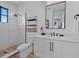 Modern bathroom with a large glass shower, contemporary fixtures, and a white vanity at 89 Avenida Messina, Sarasota, FL 34242