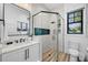 Elegant bathroom with walk-in shower, modern fixtures, and neutral tile and color palette at 89 Avenida Messina, Sarasota, FL 34242