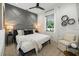 Modern bedroom features decorative accent wall, geometrically patterned decor, and neutral color palette at 89 Avenida Messina, Sarasota, FL 34242