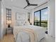 Bright and inviting bedroom with a queen size bed, large windows, and neutral tones at 89 Avenida Messina, Sarasota, FL 34242
