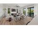 Living room with modern furniture, shiplap walls, natural light, and an inviting coastal ambiance at 89 Avenida Messina, Sarasota, FL 34242