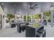 Covered outdoor living space featuring a full kitchen, seating, and access to the pool at 89 Avenida Messina, Sarasota, FL 34242