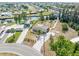 Waterfront home with lush landscaping, private boat dock, and spacious driveway, providing serene coastal living at 891 Palmetto Ne Dr, Port Charlotte, FL 33952