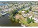 Aerial of waterfront neighborhood featuring canal-front homes and backyard docks at 891 Palmetto Ne Dr, Port Charlotte, FL 33952