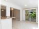 Bright dining room with sliding glass doors leading to a patio at 891 Palmetto Ne Dr, Port Charlotte, FL 33952
