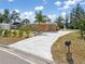 Charming single-story brick home featuring a well-maintained lawn, palm tree, and a classic mailbox at 891 Palmetto Ne Dr, Port Charlotte, FL 33952