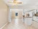 Bright, open kitchen featuring white cabinets, granite countertops, and tile floors at 891 Palmetto Ne Dr, Port Charlotte, FL 33952