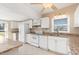 Well lit kitchen featuring white appliances, and ample countertop space at 891 Palmetto Ne Dr, Port Charlotte, FL 33952
