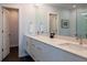 Bright bathroom with double vanity, stone countertops, and tiled flooring at 91 Avenida Veneccia, Sarasota, FL 34242