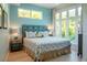 Bright bedroom featuring ample natural light, neutral decor, and a serene atmosphere at 91 Avenida Veneccia, Sarasota, FL 34242