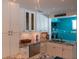 Modern kitchen with granite countertops, stainless steel appliances, and white cabinets at 91 Avenida Veneccia, Sarasota, FL 34242