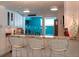 Modern kitchen with granite countertops, stainless steel appliances, and barstool seating at 91 Avenida Veneccia, Sarasota, FL 34242