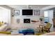 Bright living room featuring a white brick fireplace and large windows with natural light at 91 Avenida Veneccia, Sarasota, FL 34242