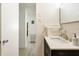 Bright bathroom featuring a modern vanity with white countertop and white tiled backsplash at 1018 Charlotte Ave, Sarasota, FL 34237