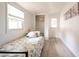 Bright bedroom featuring a floral bedspread, window, and an access door at 1018 Charlotte Ave, Sarasota, FL 34237