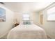 Bright bedroom featuring a white color scheme, comfortable bed, and decorative pillows at 1018 Charlotte Ave, Sarasota, FL 34237