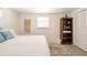 Bright bedroom features a decorative rug, comfortable bed, and beach-themed decor at 1018 Charlotte Ave, Sarasota, FL 34237