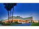 Stately hotel with an elegant entrance at dusk, showcasing lush landscaping and inviting outdoor lighting at 1018 Charlotte Ave, Sarasota, FL 34237