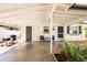 Inviting covered front porch with seating, a grill, and a well-lit entrance at 1018 Charlotte Ave, Sarasota, FL 34237