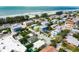 Stunning aerial view of homes near the beach, showcasing a vibrant coastal community at 113 8Th S St, Bradenton Beach, FL 34217