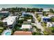 Coastal neighborhood aerial view shows proximity to beach and community pool at 113 8Th S St, Bradenton Beach, FL 34217